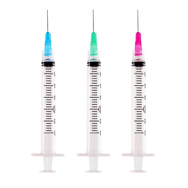 istock Coloured Syringes Isolated on White Background 182224347