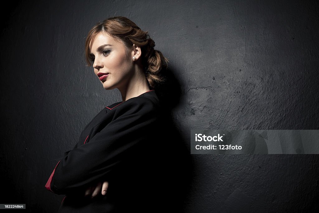 Young fashionable girl. Young fashionable girl on black background Adult Stock Photo