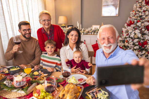 istock Family taking a selfie while having Christmas dinner at home 1822253749
