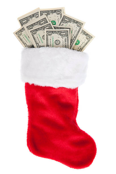 Christmas Stocking Stuffed with Money stock photo