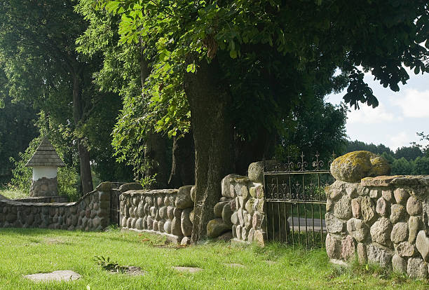 istock stone fence and green grass 182226280