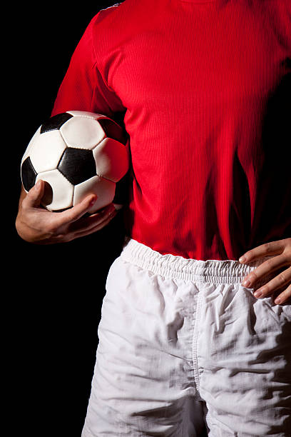 istock Player holding soccer ball 182226659