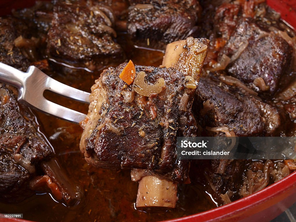 Short Rib Preparation "Tender Short Ribs of Beef, braised in red wine and vegetables in ceramic casserole." Short Ribs Stock Photo