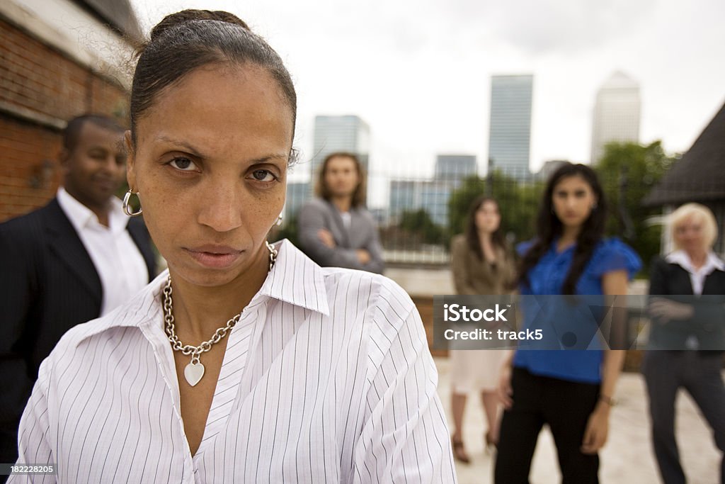 adult education: women in business "A confident look on the face of a mixed-race mature business student standing proudly with her colleagues.Horizontal, head and shoulder group portrait." 30-39 Years Stock Photo