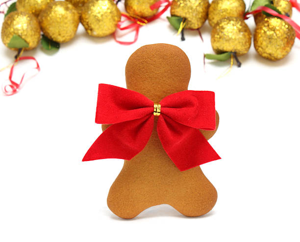 istock Gingerbread man with red christmas decoration 182228290