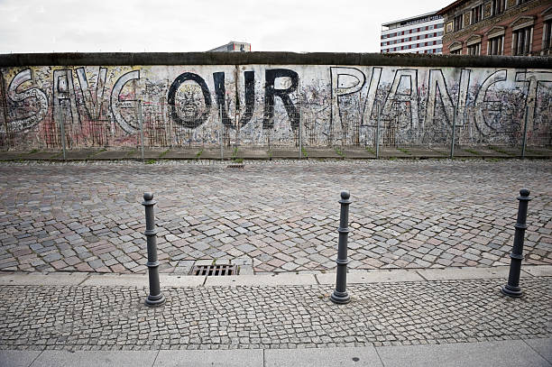 istock Part of the Berlin Wall with Save Our Planet Graffiti 182228440