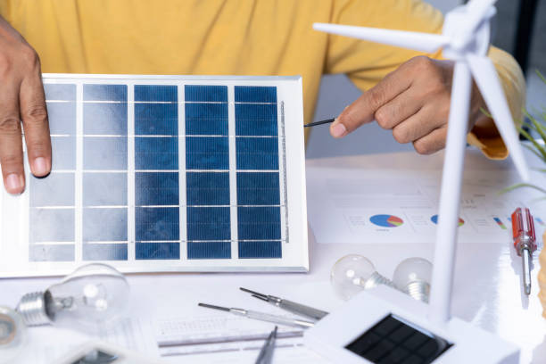 istock The man is inventing a solar panel to supply electricity to light bulbs. 1822285290