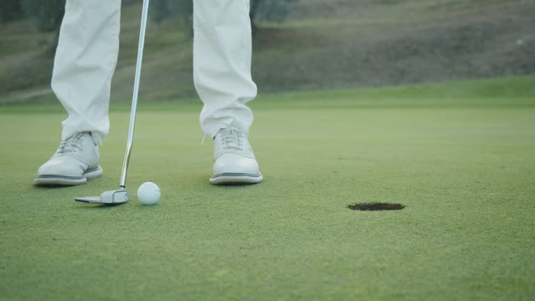 Closing putt on the green