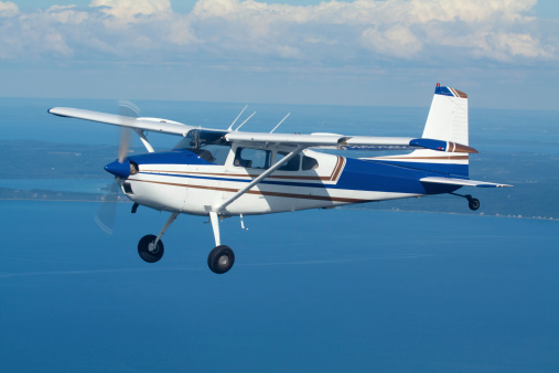 A small private aircraft in flight.