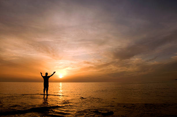 istock Man in silhouette at sunset 182228803