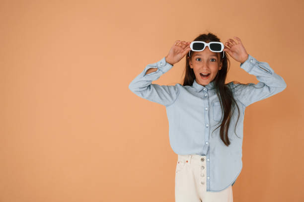 istock Cute young girl is in the studio against background 1822289679