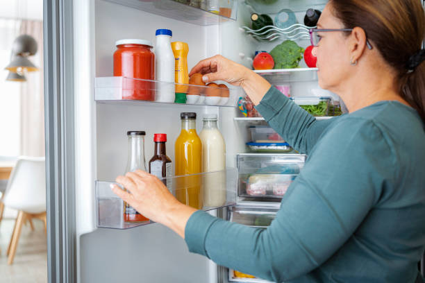 istock Woman taking out eggs from the refrigerator door 1822289684