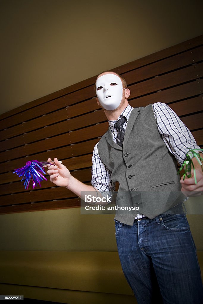 party mask Male with party favors and mask. Adult Stock Photo