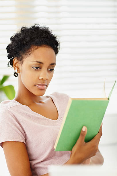 istock African American woman reading a book 182229305