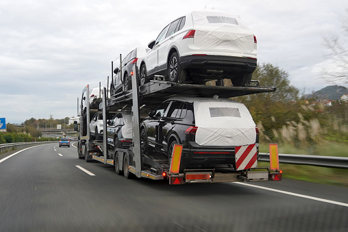 Car transport truck driving on a spanish highway