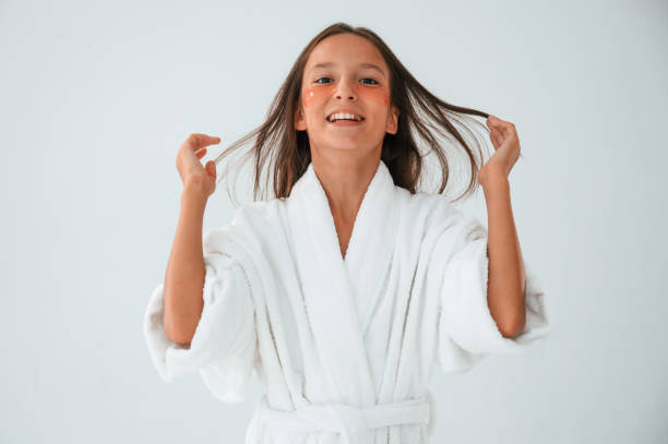 istock Young girl is in the studio using eye patches on the face 1822301551