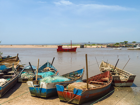 Old ships on the riverbank in Barra do Dande close to Dande, province of Bengo in Angola