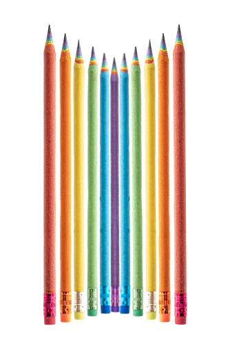 Set of Colored Pencils Made by Recycled Paper arranged on white background. Environmentally friendly stationary supplies