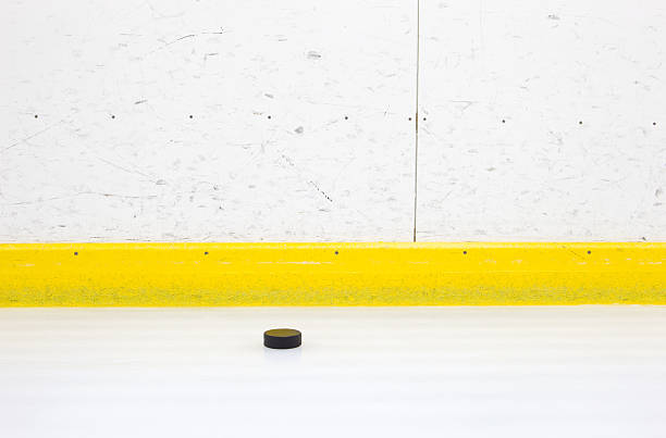 istock Hockey Boards and Ice with Puck 182230260