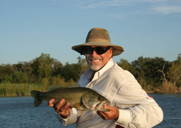 Fisherman Holding Large Mouth Bass
