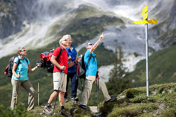 istock senior hikers on sunny day at guidepost 182230545