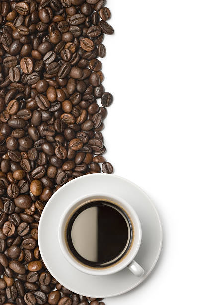 Cup of coffee on coffee beans isolated on white. More related images in