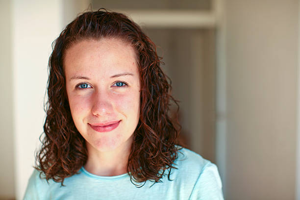 istock attractive young girl smiling 182231348