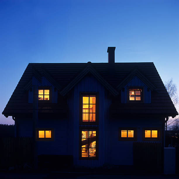 istock Illuminated house in twilight on blue sky 182231396