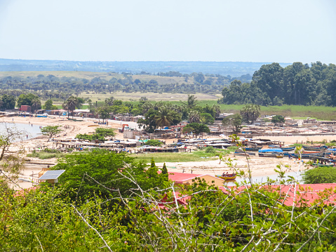 Residential district on the riverbank in Barra do Dande close to Dande, province of Bengo in Angola