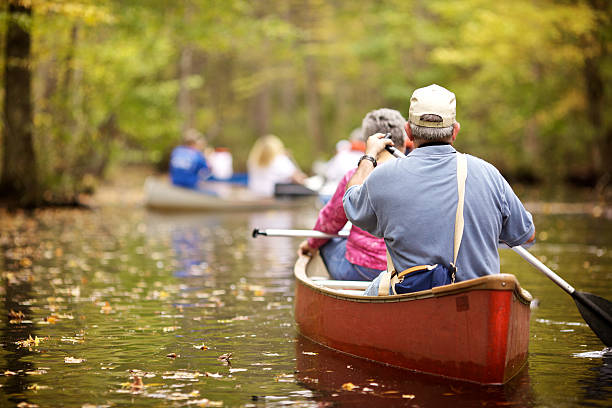 persone di tutte le età, canoa - canoeing canoe senior adult couple foto e immagini stock