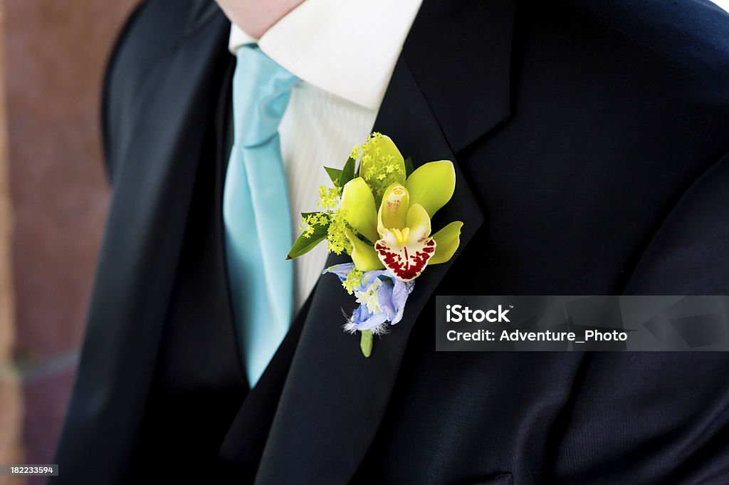 Boutonniere on Groom at Wedding Boutonniere on Groom at Wedding.  Closeup detail of flower on lapel.  Converted from 14-bit Raw file.  sRGB color space. Adult Stock Photo