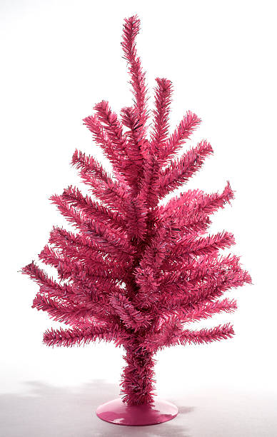Little Pink Christmas Tree Funny little handmade Christmas Tree in hot pink tinsel. pink christmas tree stock pictures, royalty-free photos & images