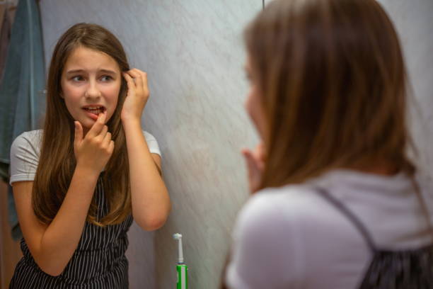 istock Little girl experiences toothache after brushing her teeth 1822345875