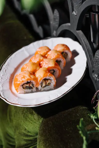 Photo of Salmon Fried sushi roll with eel and cheese