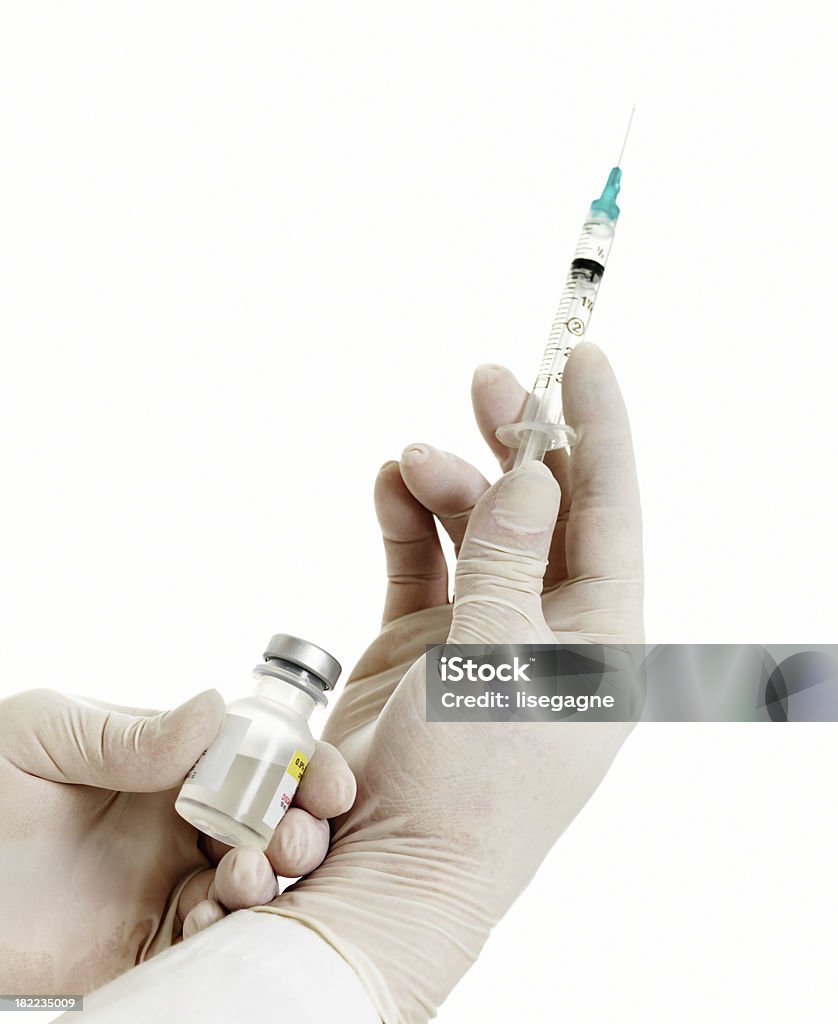 Vaccino in mani - Foto stock royalty-free di Accudire