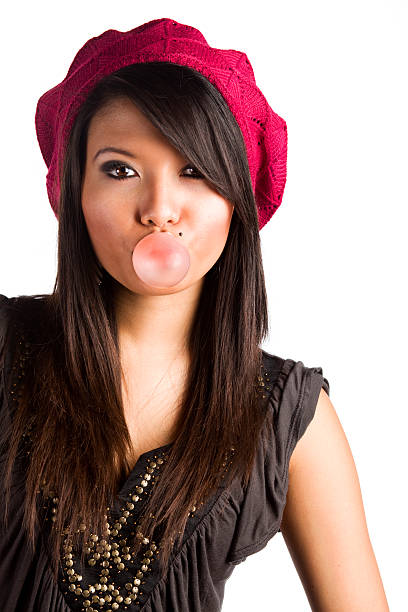 istock Filipino Girl Blows Bubble with Gum 182235020