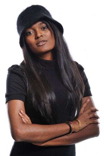 Portrait of young Indian woman with a hat on and an attitude