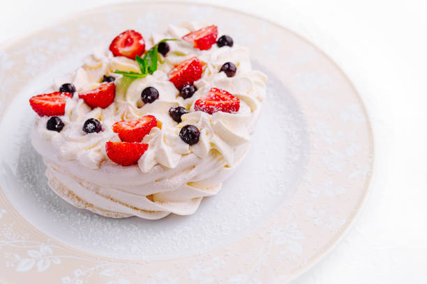 istock Pavlova cakes with cream and fresh berries on plate 1822363796