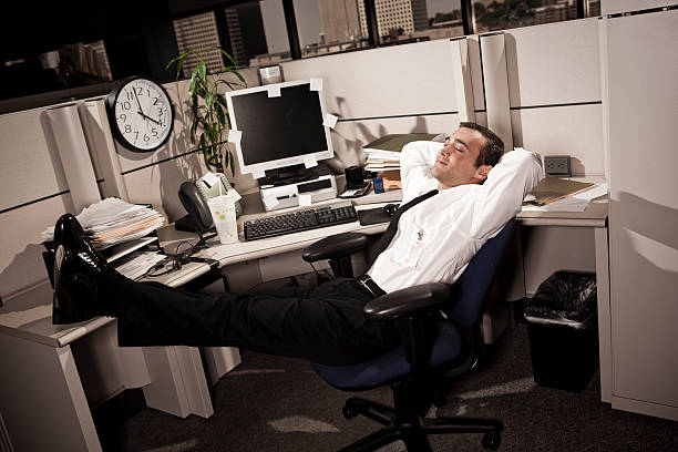 istock Business Man relaxing in Office Cubicle 182236465