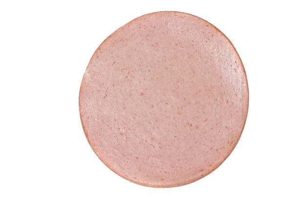 Slice of Bologna Single slice of bologna (baloney) isolated on white. baloney photos stock pictures, royalty-free photos & images