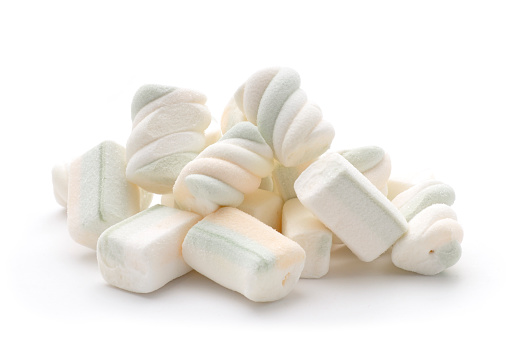 A small pile of marshmallows isolated on white.