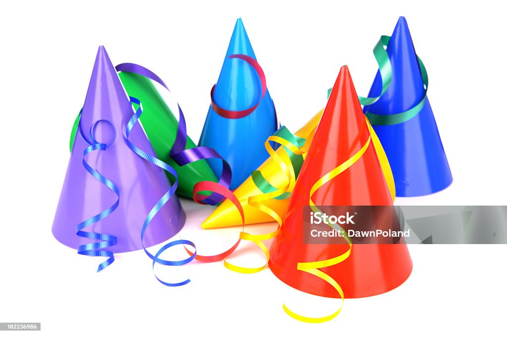 Multi colored party hats with ribbons  Multi colored party hats with curly ribbon on white. Blue Stock Photo