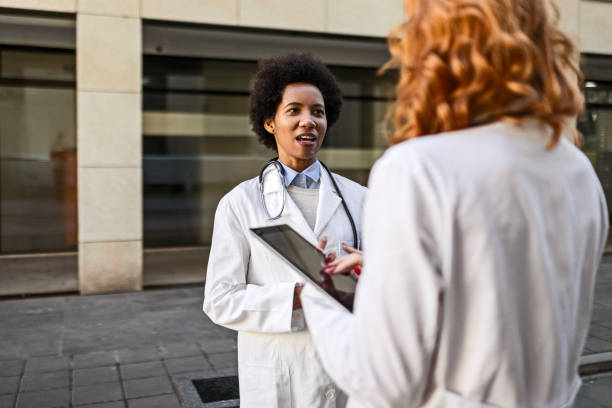istock Female Professionals Strolling Together in Teamwork 1822376204