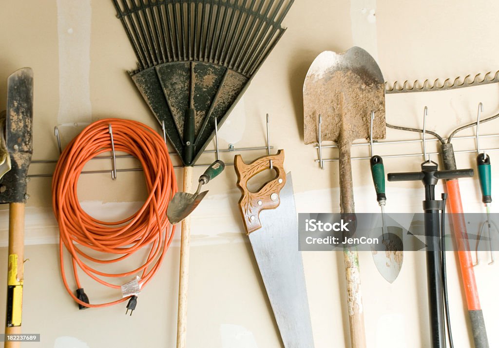 Well used tools "Old, dirty tools in a garage" Extension Cord Stock Photo