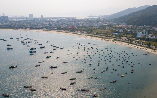 Aerial photo of boat dock in the early morning near Son Tra peninsula, Da Nang city