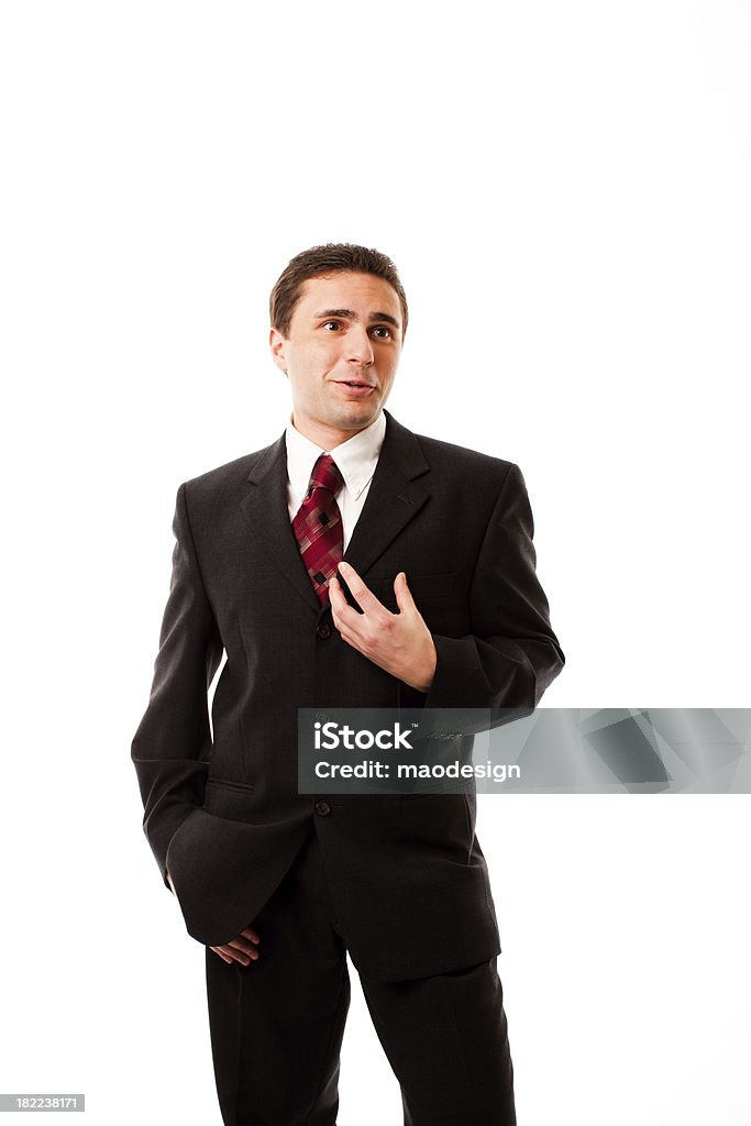 Businessman Talking and Gesturing, Studio Portrait A mid adult businessman talks while gesturing with his hand. Isolated on white, studio portrait. Adult Stock Photo