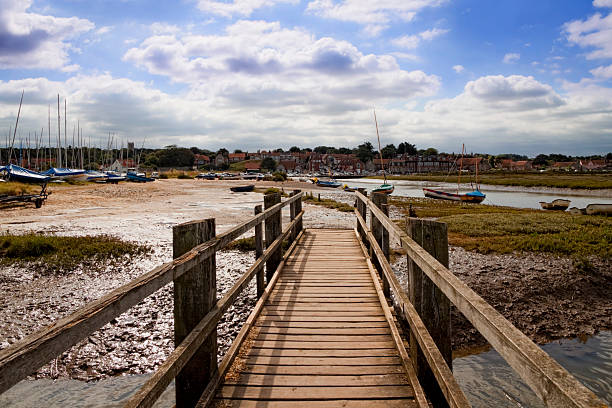 Blakeney from the marshes "The view from the salt marshes at Blakeney, inland to the harbour and village.Some Blakeney images from my portfolio. Please see my lightboxes for similar." east anglia stock pictures, royalty-free photos & images