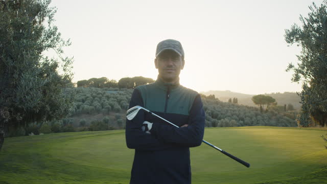 Portrait of a golfer on the golf course at sunset