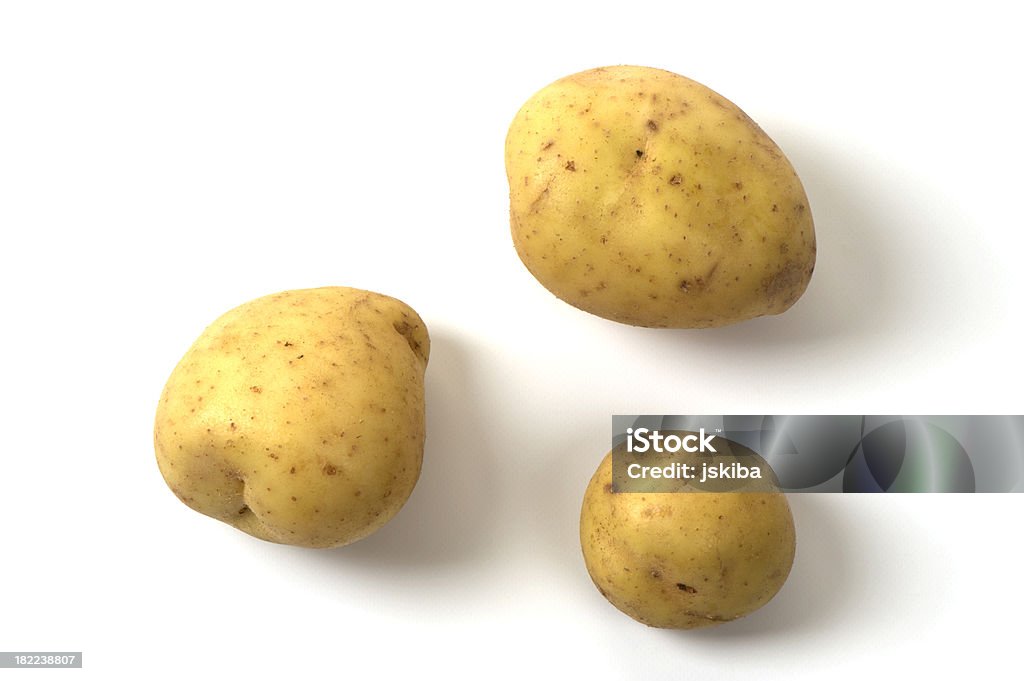 Tres papas batidas de oro sobre fondo blanco - Foto de stock de Patata libre de derechos