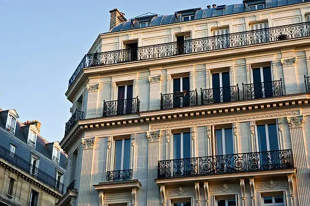 "A row of apartments on a Paris, France street."
